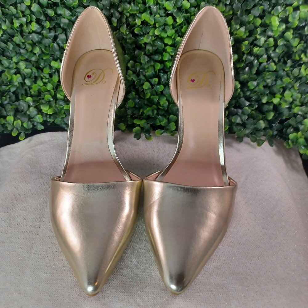 Gold high heeled shoes